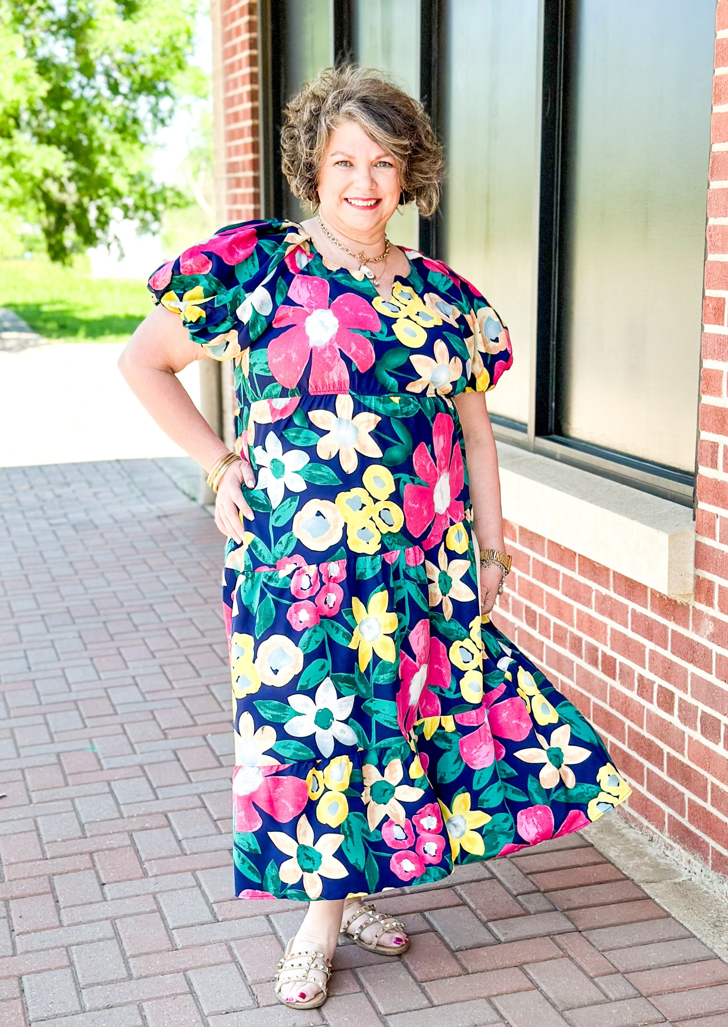 bright floral on a navy background angled tiered midi dress - puff sleeve