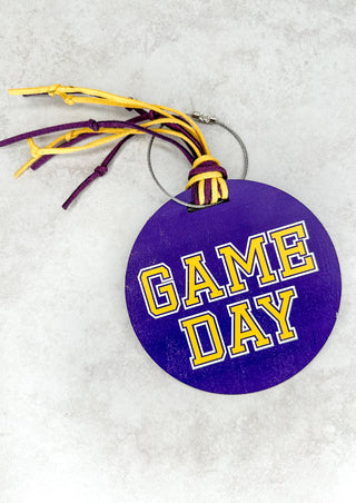 Wooden purple and gold GAME DAY luggage tag has space on the back to fill in your name, address and phone number