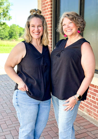 sleeveless airflow top in  black - v-neck