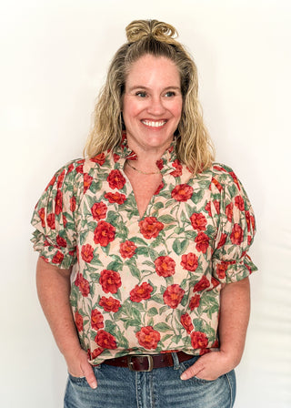 Light Pink short sleeve top, v-neck with ruffle detail.  Elastic detail on the sleeve.  Large Rose pattern with jade leaves.
