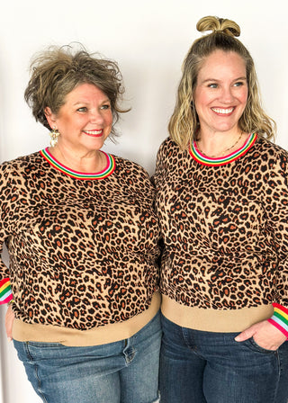 Long sleeve sweater in bold leopard print and colorful stripe collar.