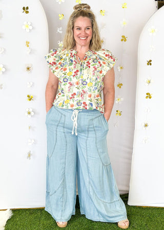 Lightweight chambray palazzo pants with pockets.  White rope drawstring waist.