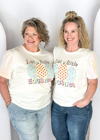white short sequin sleeve top with "just a little eggstra" in pastels on the front - iridescent sequins on sleeves