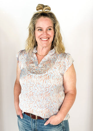 ruffle collared notched neck short ruffle sleeve stop - abstract print of blue and orange