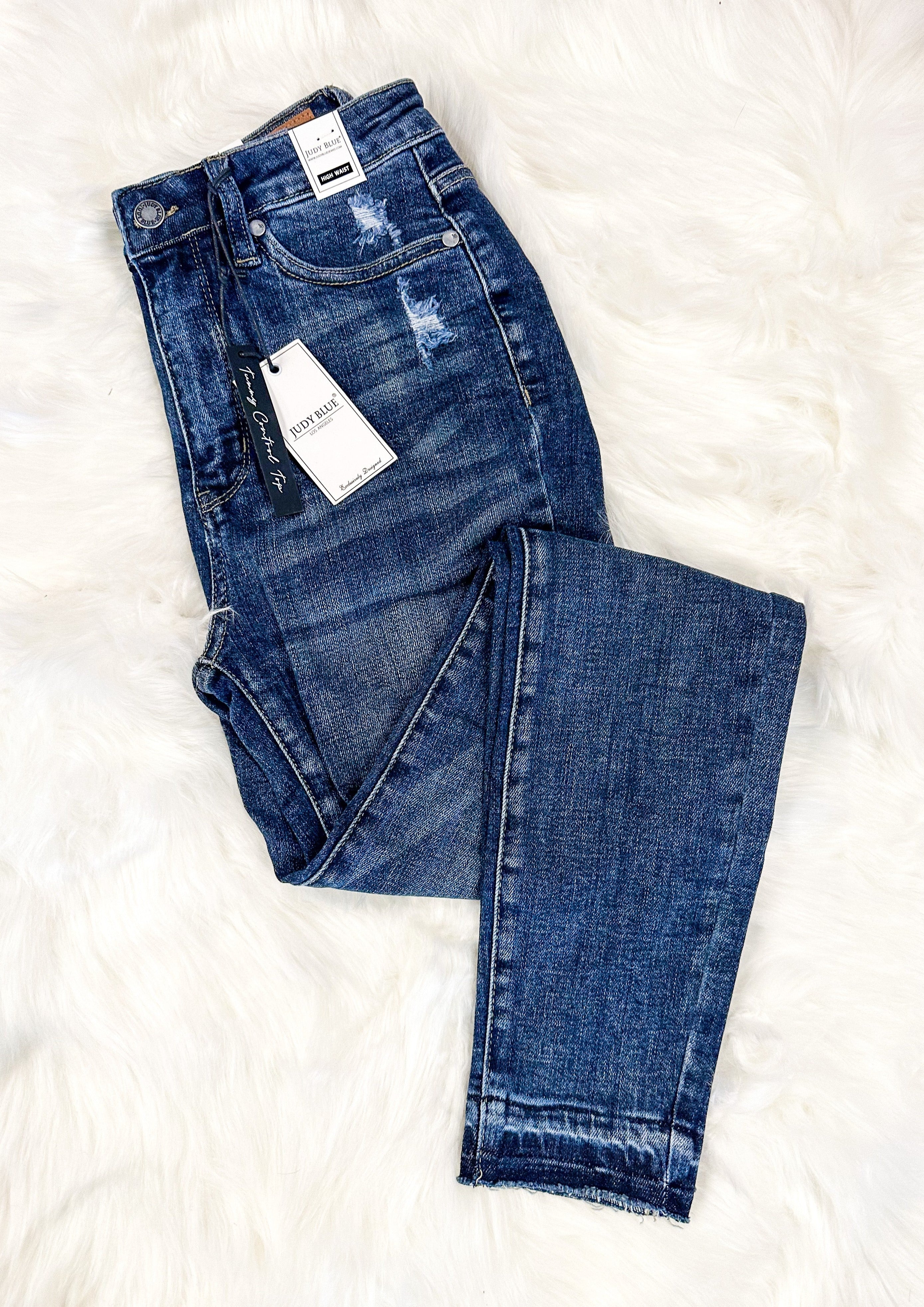 Judy Blue Unfinished Hem Hi Rise Tummy Control Skinny Jean with front and back pockets, zipper and front button closure