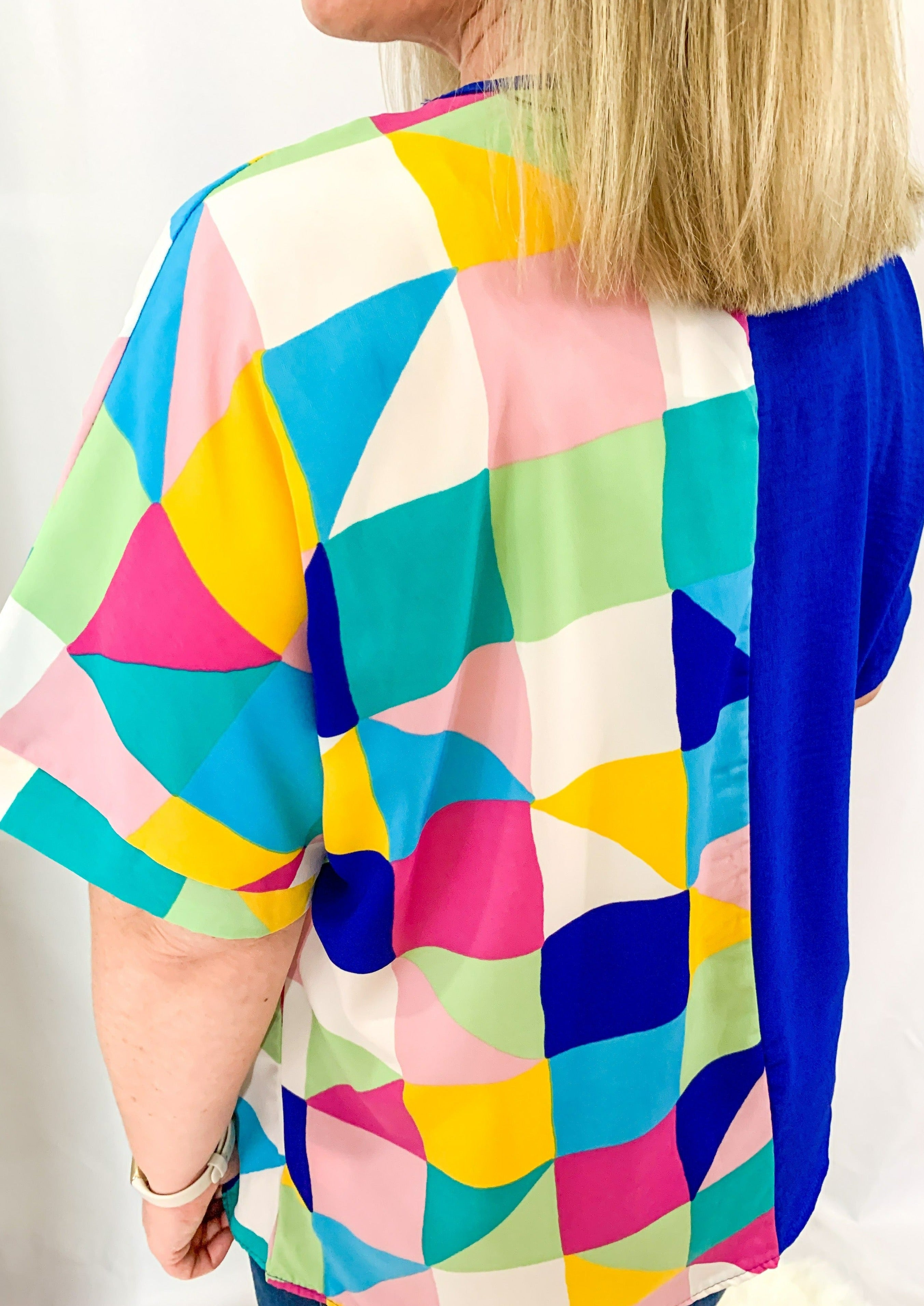Half multicolored geometric pattern and half blue v neck top