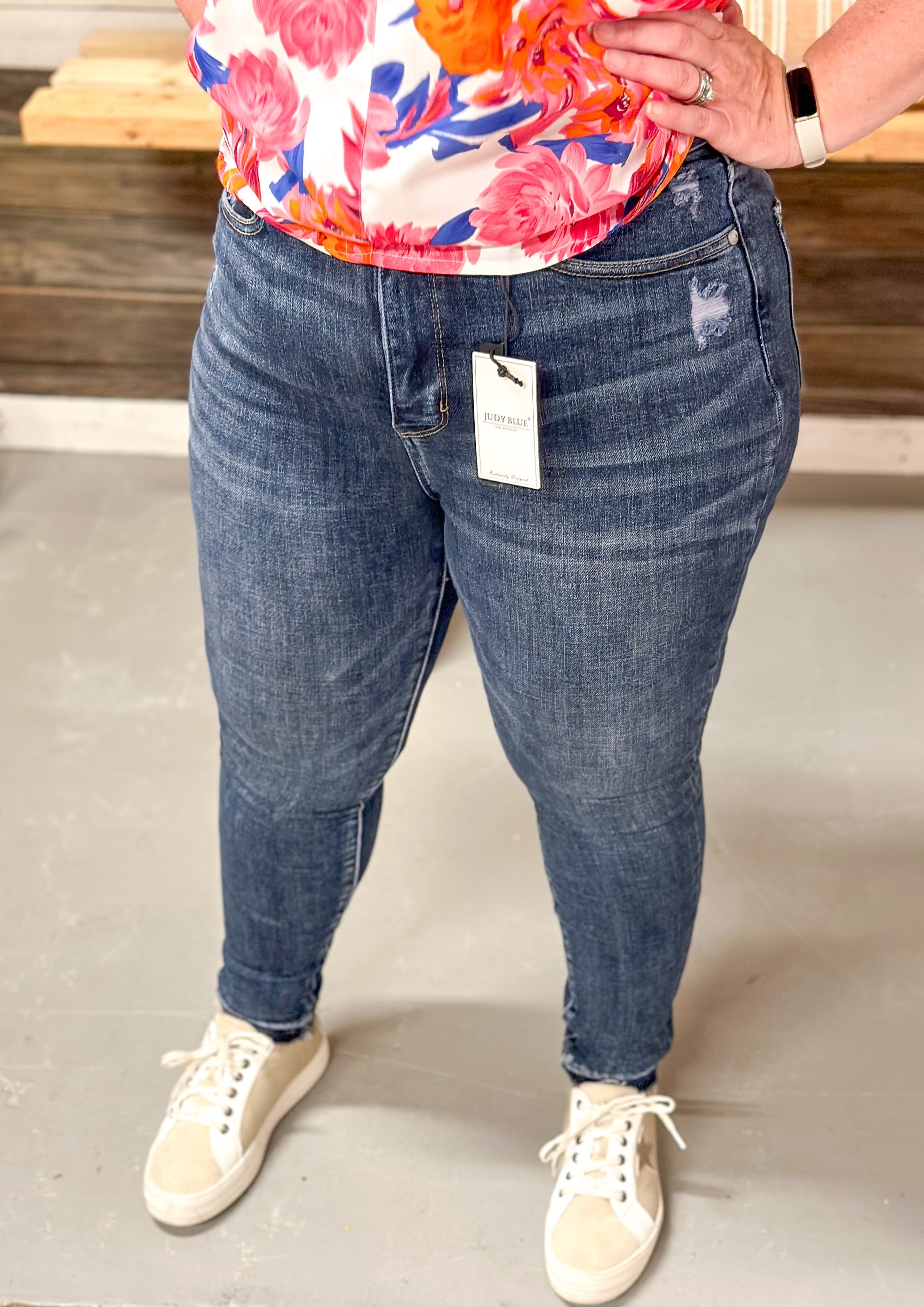 Judy Blue Unfinished Hem Hi Rise Tummy Control Skinny Jean with front and back pockets, zipper and front button closure