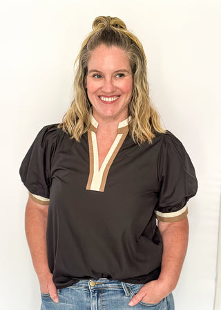 Black short sleeve top with contrast in ivory and beige on the sleeves and notch collar. 