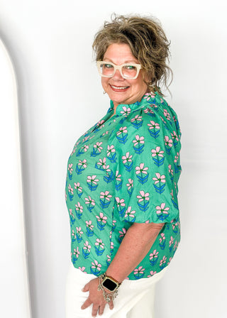 green floral v-neck top with puff short sleeves