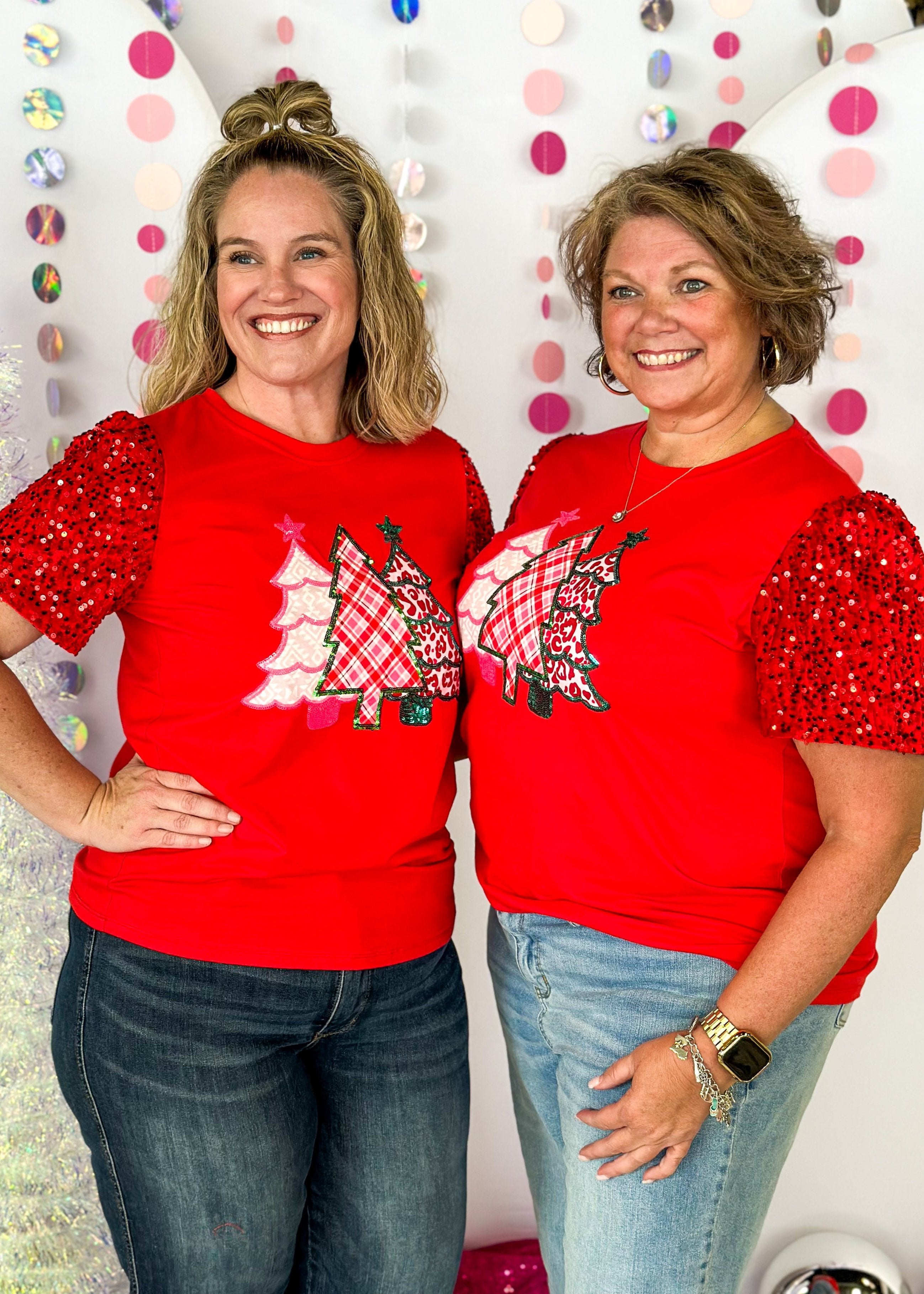 red short sleeve top with red sequin sleeves, round neck, sparkly trio of trees patch on the front