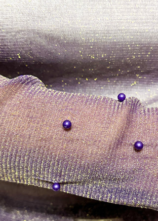 Long sleeve mock neck top with pearl accented sleeves in purple with gold metallic threads.