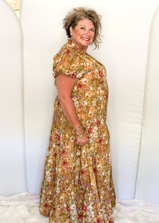 Terracotta with fall florals short sleeve tiered maxi dress.  V-neck and Puff Sleeve and lined. 