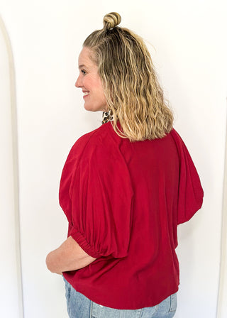 dolman short sleeve top in garnet color with double leopard stripe v-neck