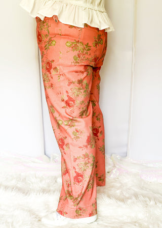 Floral print wide-leg pants in soft coral tones with green accents