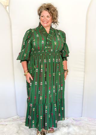 Forest Green Maxi Dress with multi color flower and vine detail throughout.  3/4 length sleeve with smocking around the v-neck, sleeves and waist.  