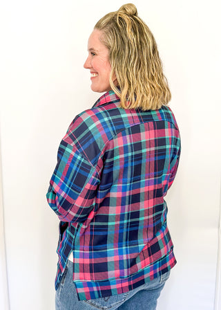 Bright plaid quarter-zip pullover in navy, teal, and pink with front pockets.