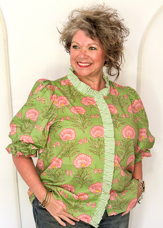 matcha green floral puff sleeve blouse with pink oversized floral print and striped contrast trim along the neckline and front placket.