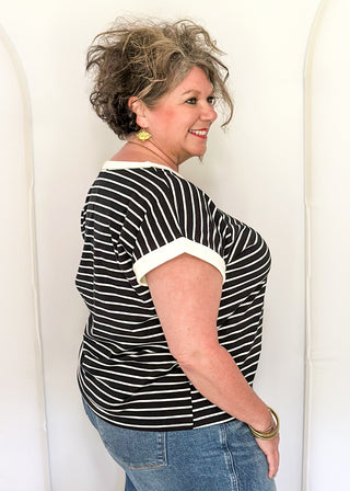 wide striped top with cuffed sleeves, and white banded rounded neckline.