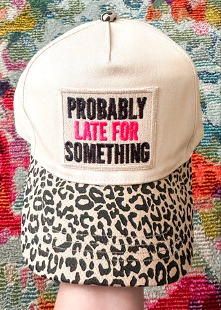 Neutral snap back cap with leopard print  bill and “Probably Late For Something” embroidery