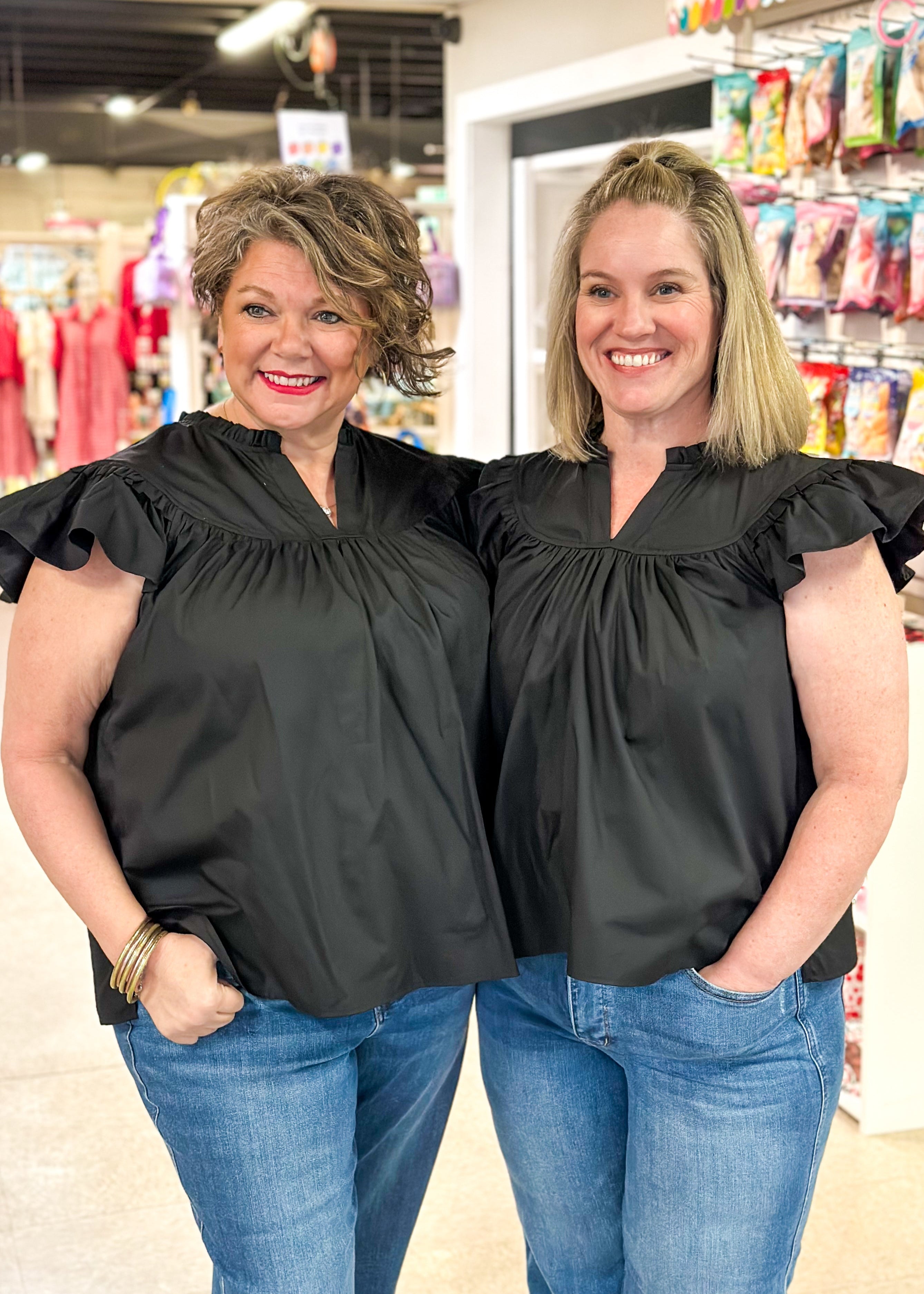 notched v-neck ruffle short sleeve top with ruffle neck and seam above the chest - black