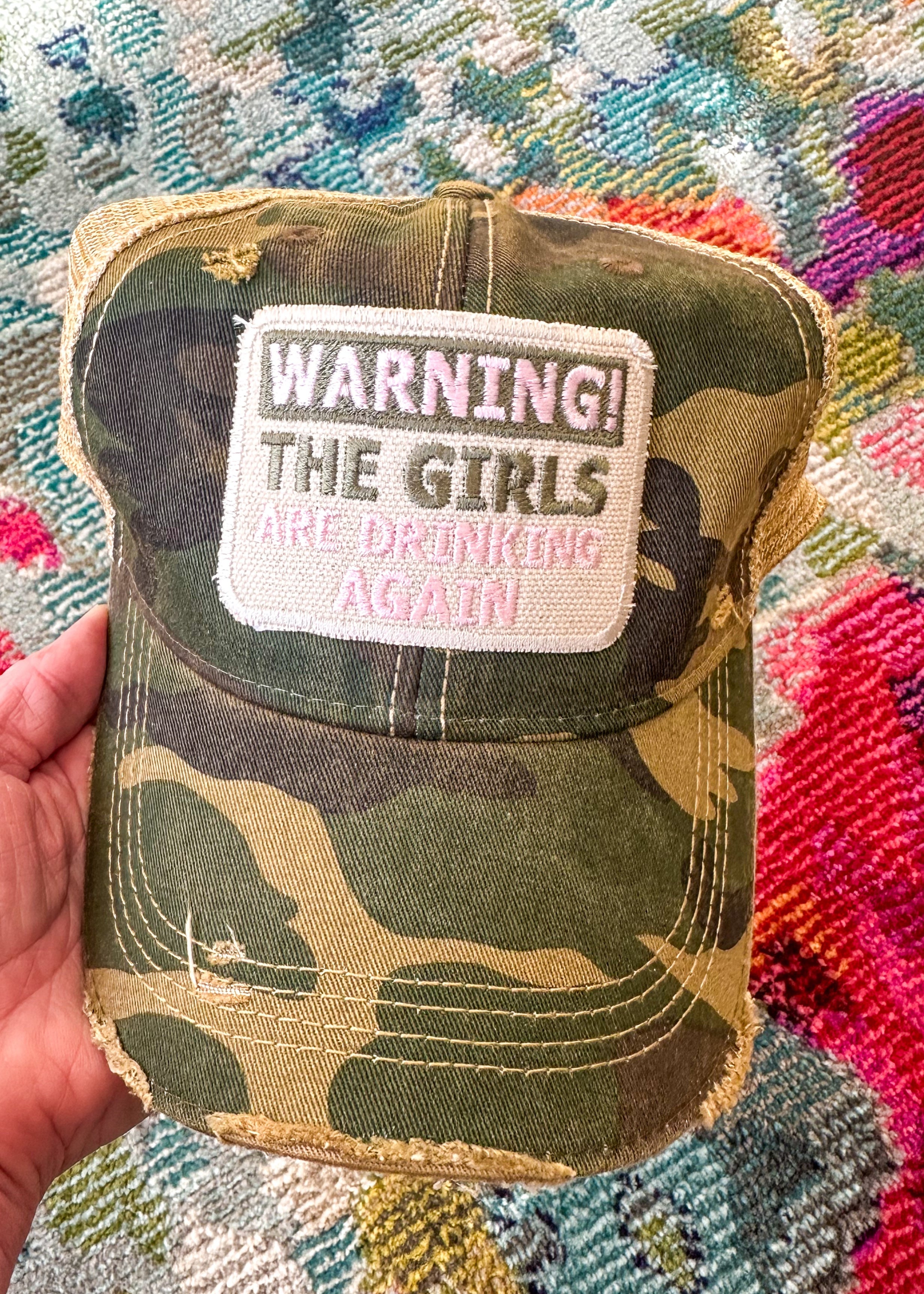 Camo with khaki snapback hat with "WARNING The Girls Are Drinking Again" embroidered patch.