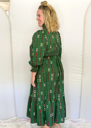 Forest Green Maxi Dress with multi color flower and vine detail throughout.  3/4 length sleeve with smocking around the v-neck, sleeves and waist.  