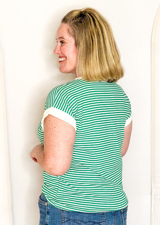 Green and white striped short sleeve top with white banding on sleeve and collar. 