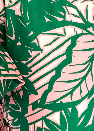 Close up of ruffle sleeve midi dress with pink and green tropical leaves