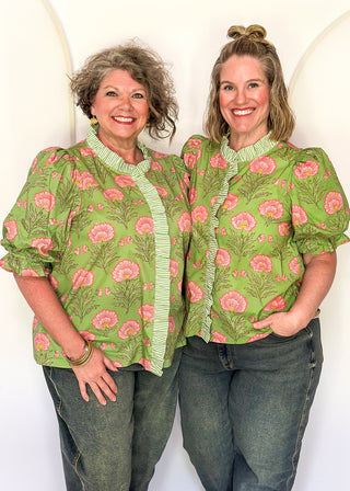matcha green floral puff sleeve blouse with pink oversized floral print and striped contrast trim along the neckline and front placket.