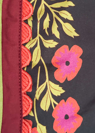 floral black -neck with ribbons of green and wine around v-neck and same colored floral pattern on  top - short sleeve