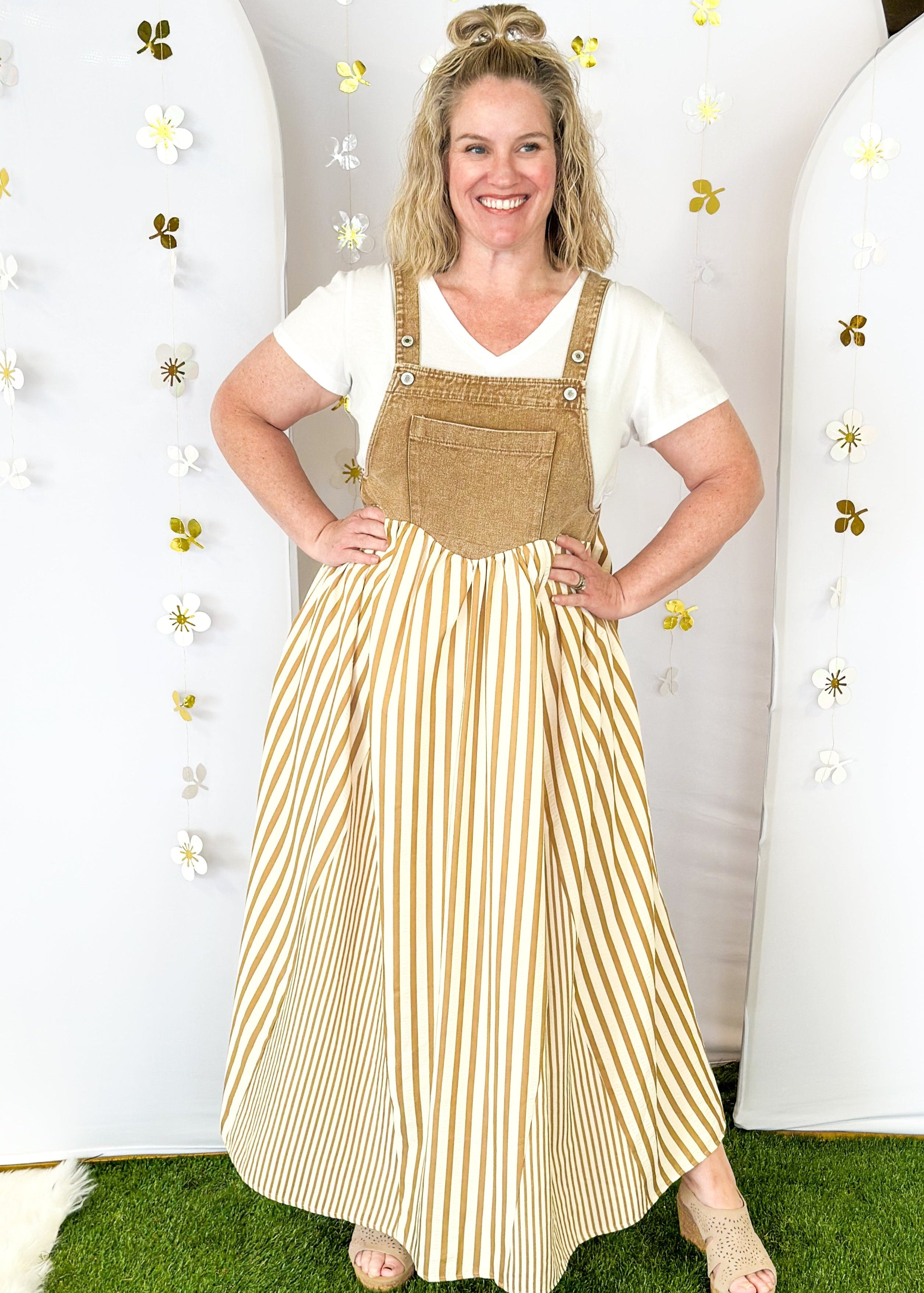 Maxi dress with pockets. brown vertical stripes on the bottom and brown denim overall top. Large front pocket and two buttons on either strap to adjust length.