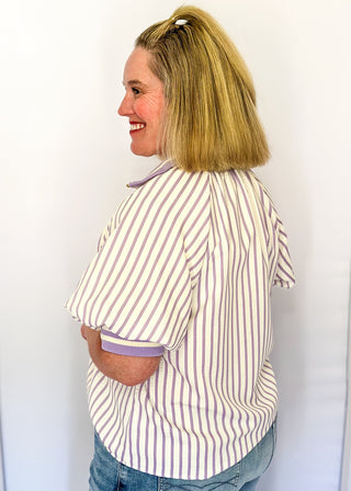 Women’s lavender striped short sleeve 1/4 zip top with lightweight fabric, stripe elastic sleeve and collar detail.