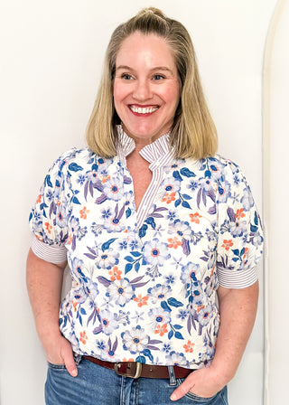 Women’s floral blouse with button front detail and lavender striped contrast accents
