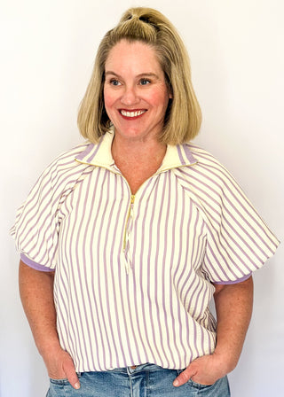 Women’s lavender striped short sleeve 1/4 zip top with lightweight fabric, stripe elastic sleeve and collar detail.