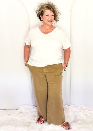 Judy Blue light brown wide-leg crop jeans featuring a high-rise waist, relaxed fit, and ankle-length hem.