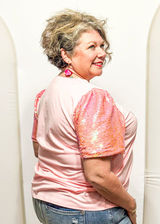 Sequin short sleeve top with 3 heart appliques.