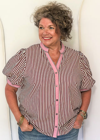 women wearing burgundy stripe button up top 
