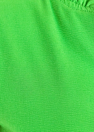 close up of women's ruffle collar blouse with 3/4 sleeve- in kelly green