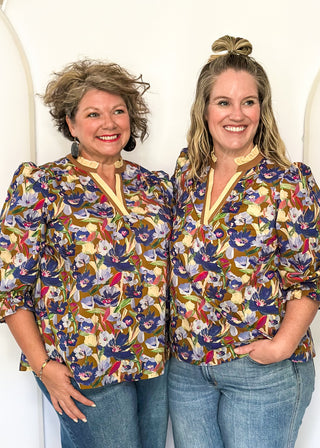 floral top with cream and brown striped detail around collar and v-neck - 3/4 sleeve - browns, blues, magenta, creams, greens, for floral colors