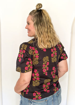 floral black -neck with ribbons of green and wine around v-neck and same colored floral pattern on  top - short sleeve