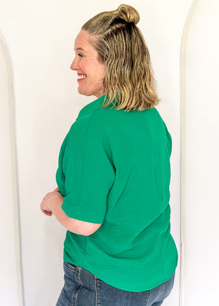 Green collared top with v-neckline 