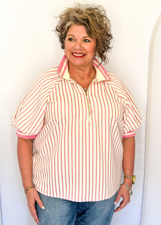 Women’s pink striped short sleeve 1/4 zip top with lightweight fabric, stripe elastic sleeve and collar detail.