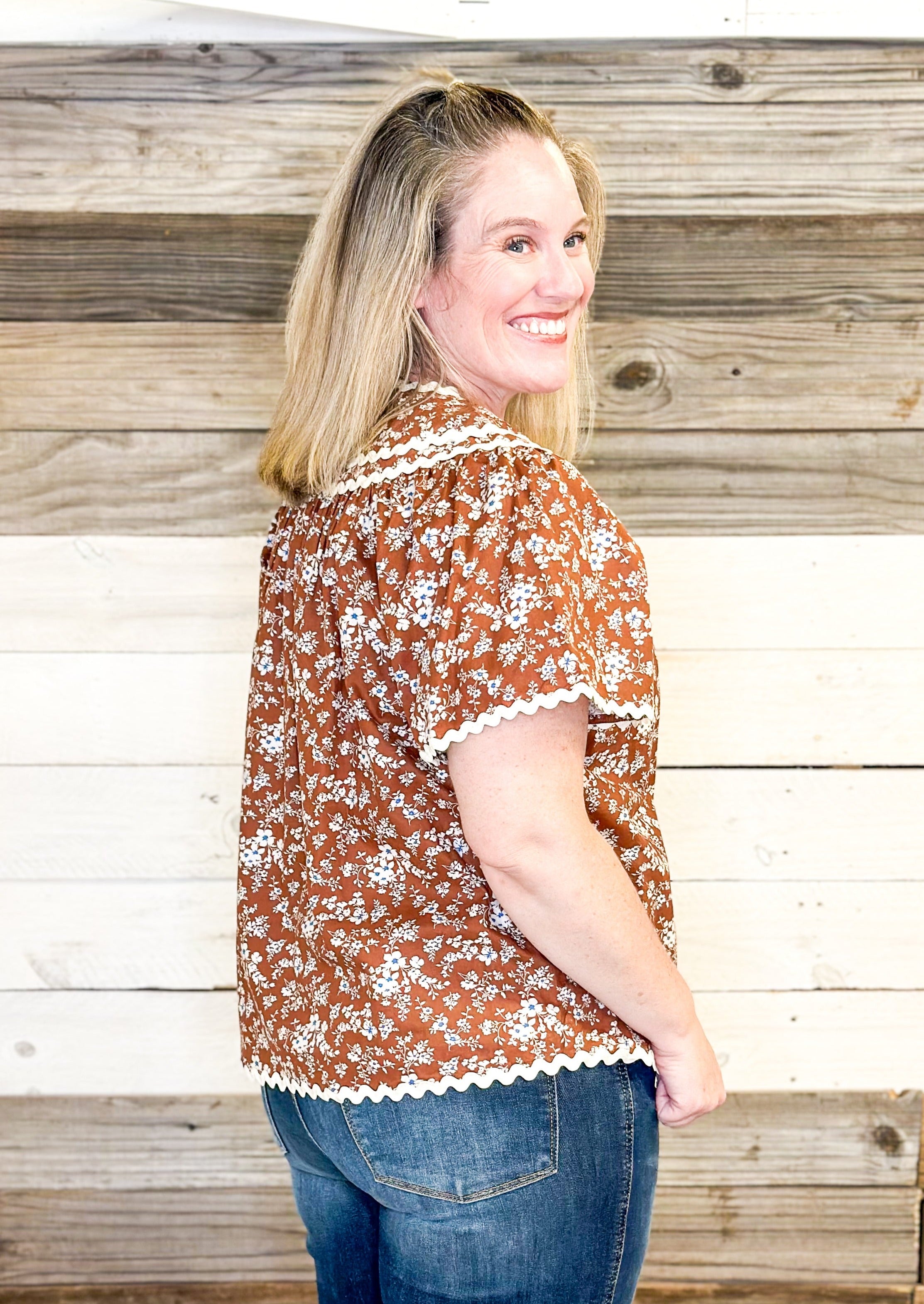 brown floral with hints of blue top - rick rack edging detail - small v-neck top with tie neck