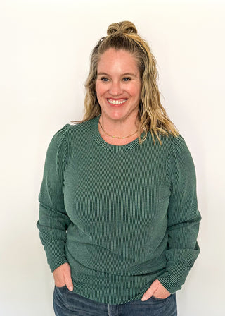 long sleeve ribbed top with cuff sleeve and small puff detail in shoulder. crew neck. 