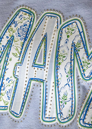 Close up of blue Mama graphic tee with flat rhinestone accents and relaxed fit.