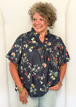 woman in Navy flower blouse