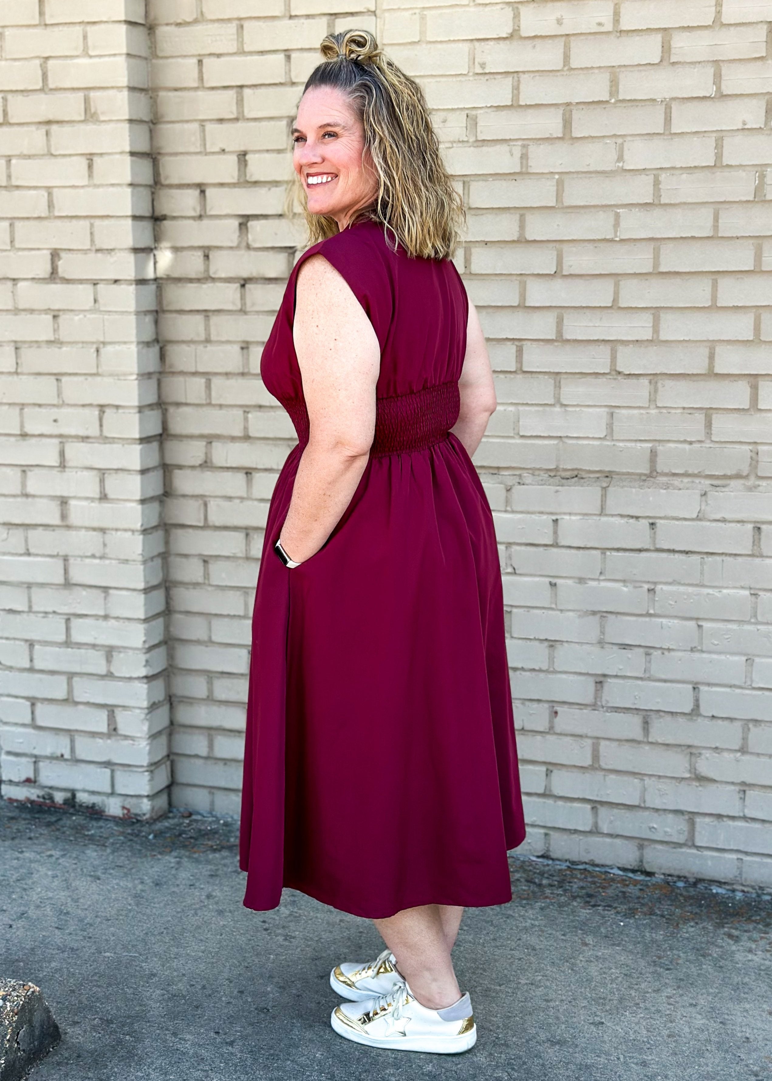 entro brand merlot colored midi dress with gold zipper down the front, smocked waistband, lined and pockets