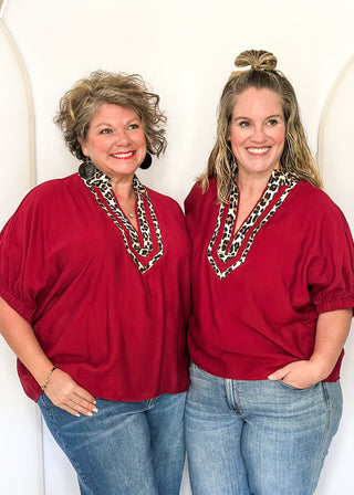 dolman short sleeve top in garnet color with double leopard stripe v-neck