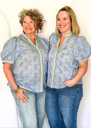 Short-sleeve blue floral button up top with contrast detailing