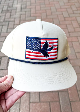cream baseball cap with american flag and bird embroidery patch on the front - snapback